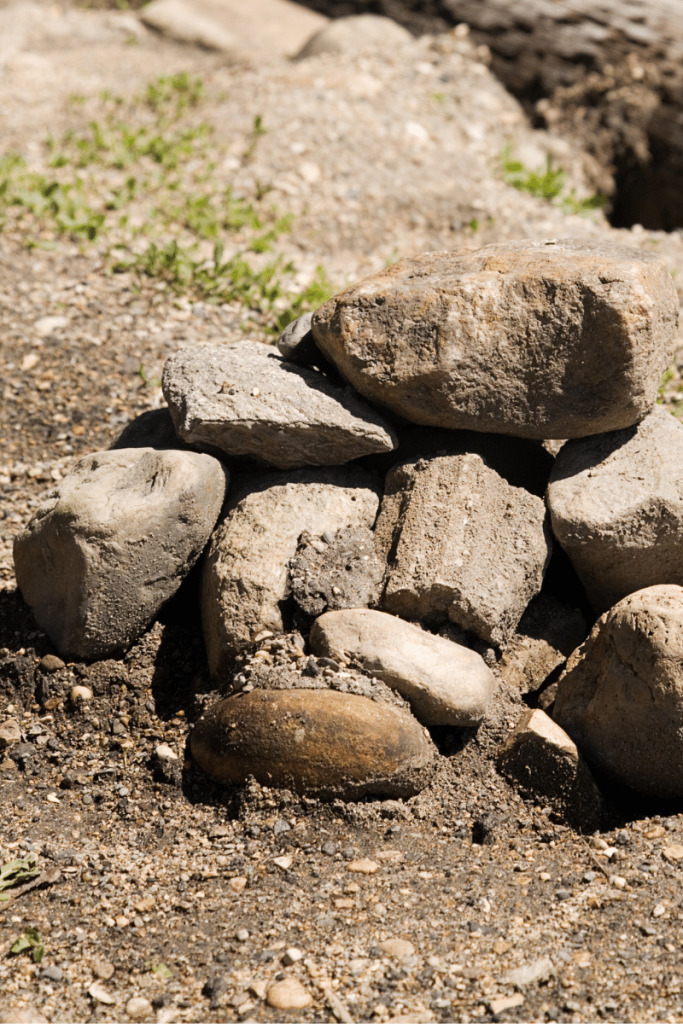 small pile of medium rocks on ground