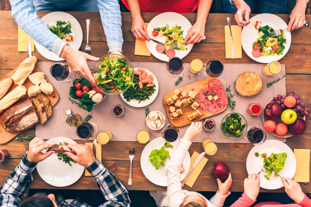 birds eye view of people eating healthy meal on a farmhouse picnic table