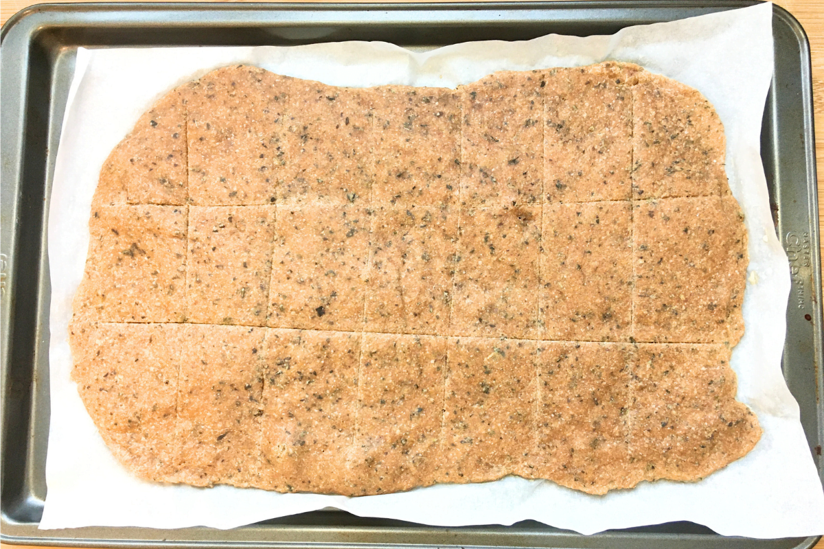 sourdough crackers on a baking sheet