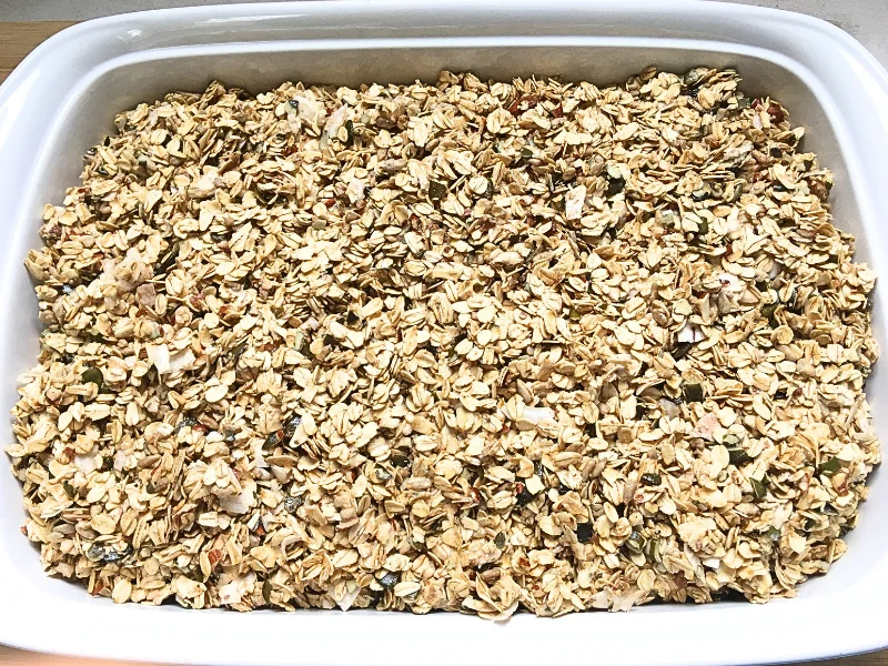 white baking dish with uncooked granola