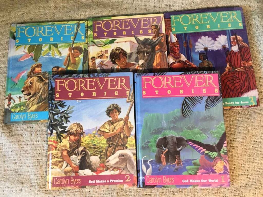5 kids bible story books covering from Genesis to Revelation laying on blanket