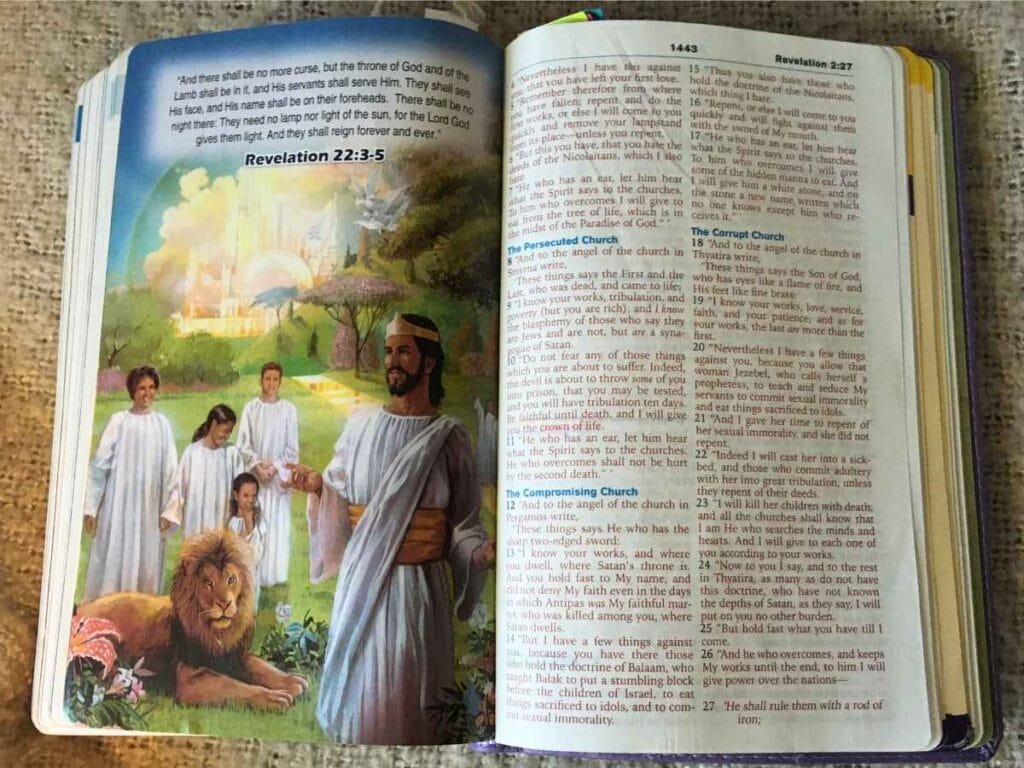 open bible with picture of heaven and Jesus